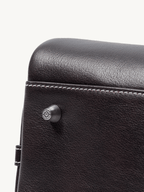 Songmont Large Yore Bowling Bag Ebony - close-up of the stud and contrast stitching