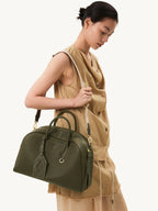 Songmont Large Yore Bowling Bag Moss - worn cross-body, model looking down