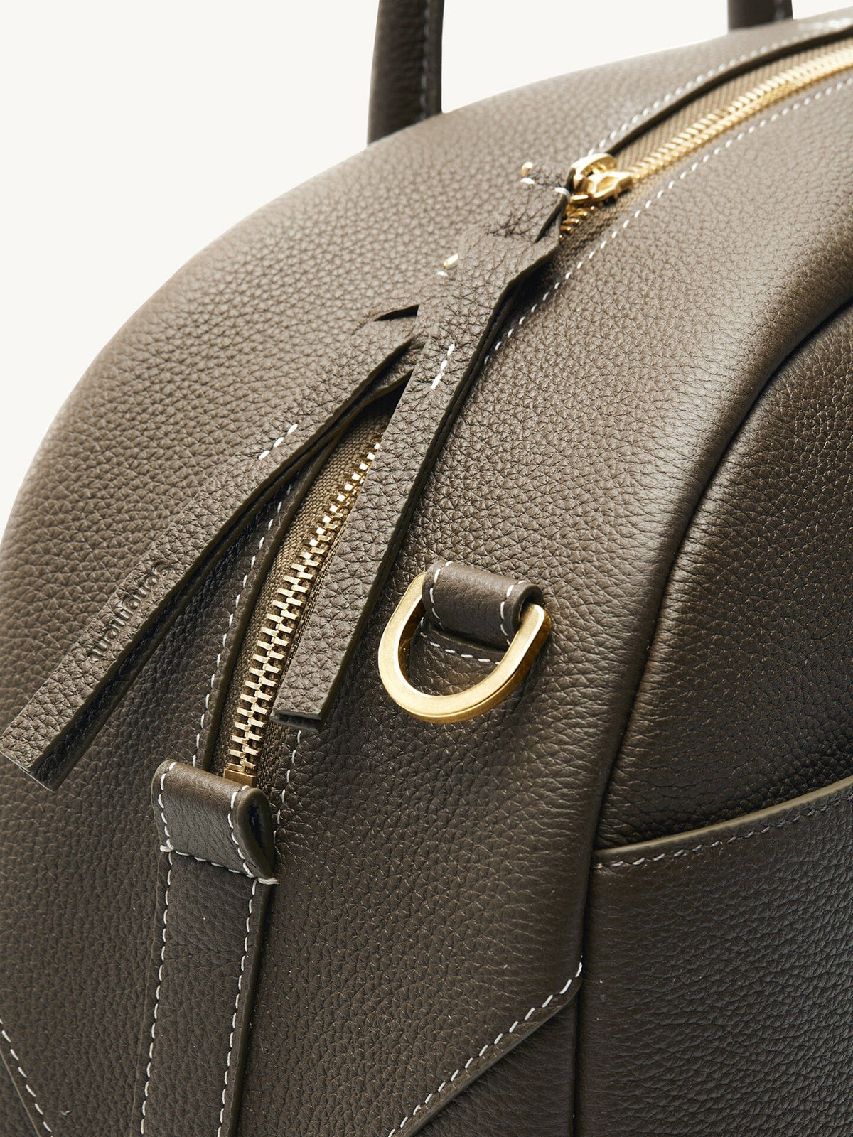 Songmont Large Yore Bowling Bag Moss - close-up of the gold zip and D-ring