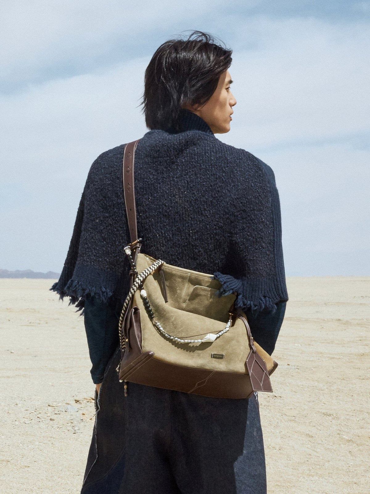 Songmont Large Yore Hobo Bag Dune Suede - worn across the back on a desert backdrop