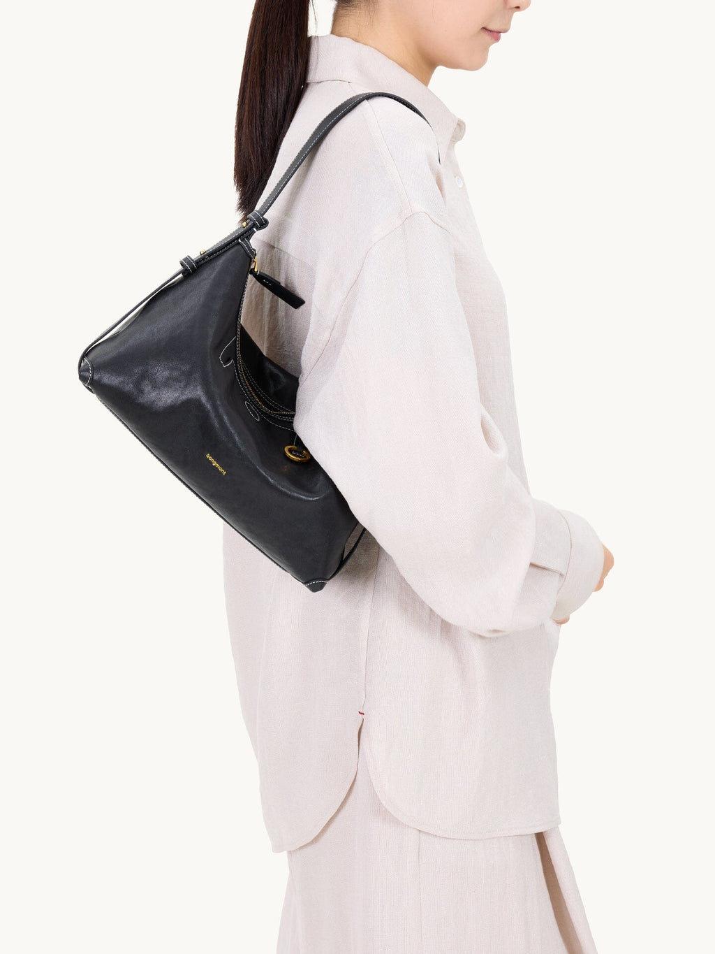 Songmont Large Yore Hobo Bag Onyx - worn on the shoulder, close side view