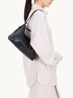 Songmont Large Yore Hobo Bag Onyx - worn on the shoulder, close side view
