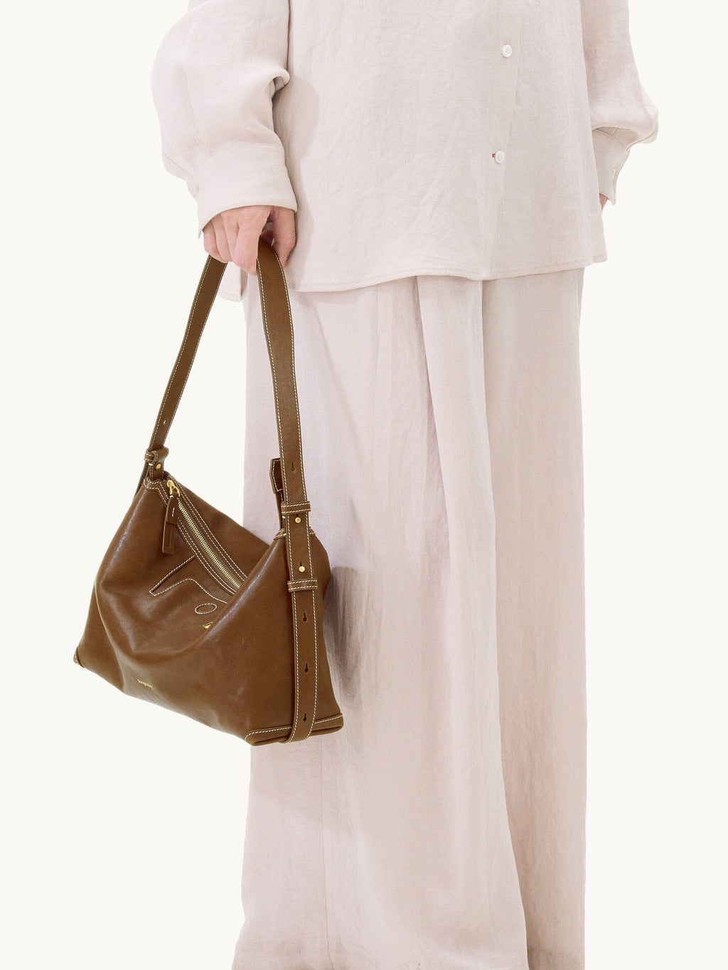 Songmont Large Yore Hobo Bag Sandal - strap held in hand