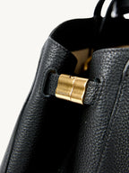 Songmont Large Yore Tote Bag Onyx - close-up of the gold side joint