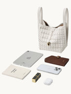 Songmont Lattice Bucket Bag Cloud - flat lay with iPad Mini and essentials