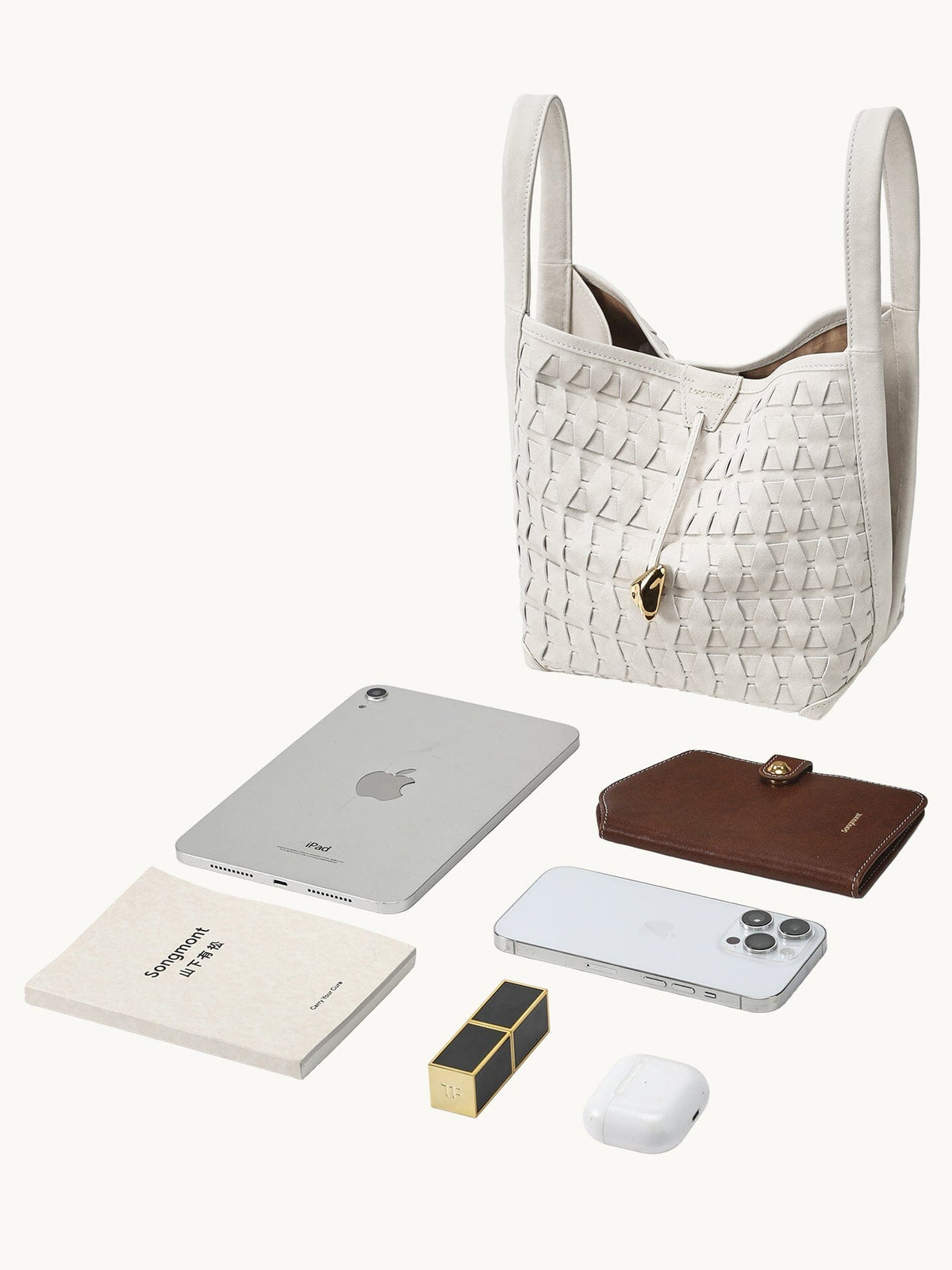 Songmont Lattice Bucket Bag Cloud - flat lay with iPad Mini and essentials