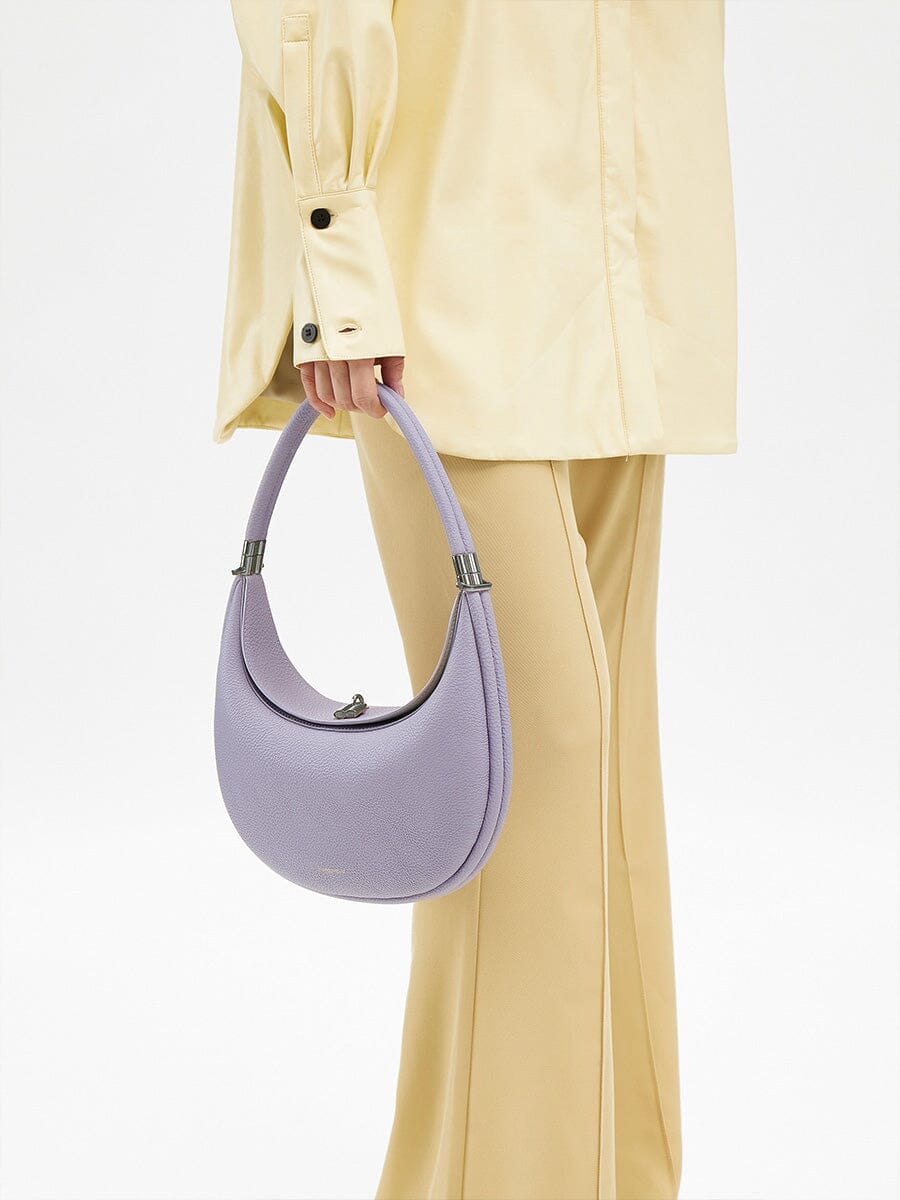 Songmont Luna Bag Lavender - carried by the top handle