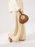 Songmont Luna Bag Mocha - held by the handle