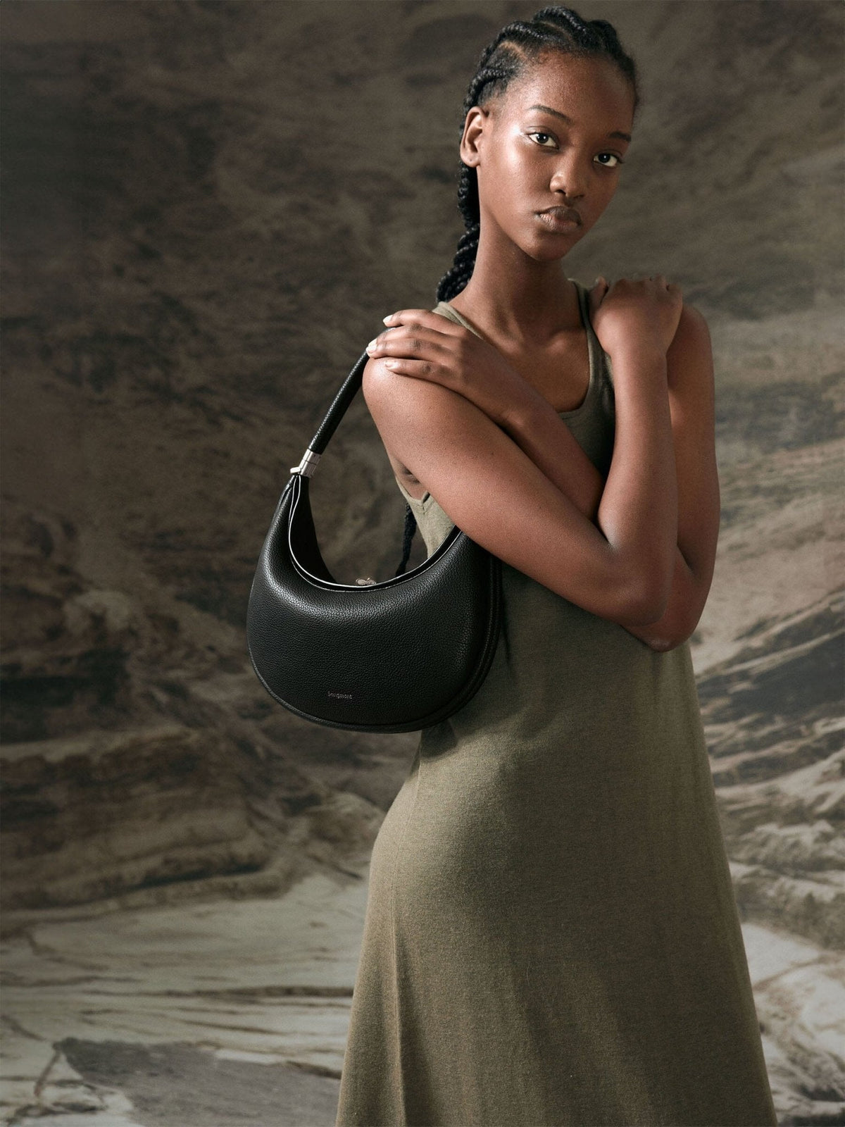 Songmont Luna Bag Onyx - worn on the shoulder with an olive-green dress