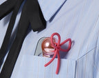 medicube x FOREVER:CHERRY Ribbon Cherry Glass Hair Comb Pink, folded in a shirt pocket
