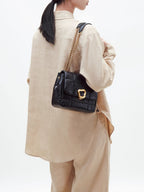 Songmont Medium Chocolate Bag Onyx - worn on the shoulder by its gold chain strap