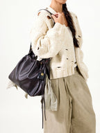 Songmont Medium Gather Bag - Ebony worn, styled with knitwear