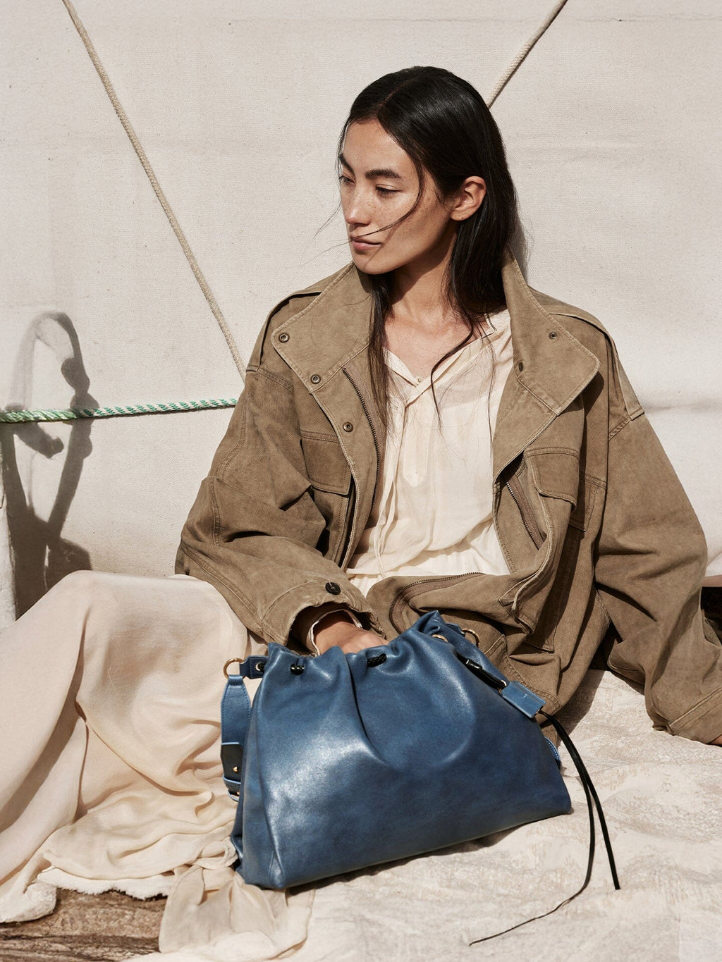 Songmont Medium Gather Bag - Navy worn, drawstring closure detail