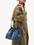 Songmont Medium Gather Bag - Navy with adjustable straps, silver hardware angle