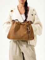 Songmont Medium Gather Bag - Ochre Suede drawstring and charm detail
