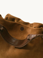 Songmont Medium Gather Bag - Ochre Suede textured cowhide, strap detail