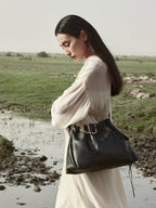 Songmont Medium Gather Bag - Onyx worn crossbody, gold bead detail