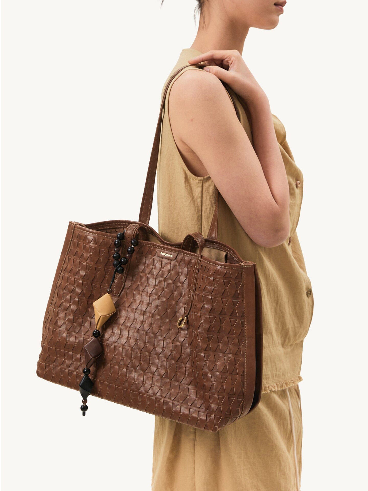 Songmont Medium Lattice Tote Sandal - worn on the shoulder