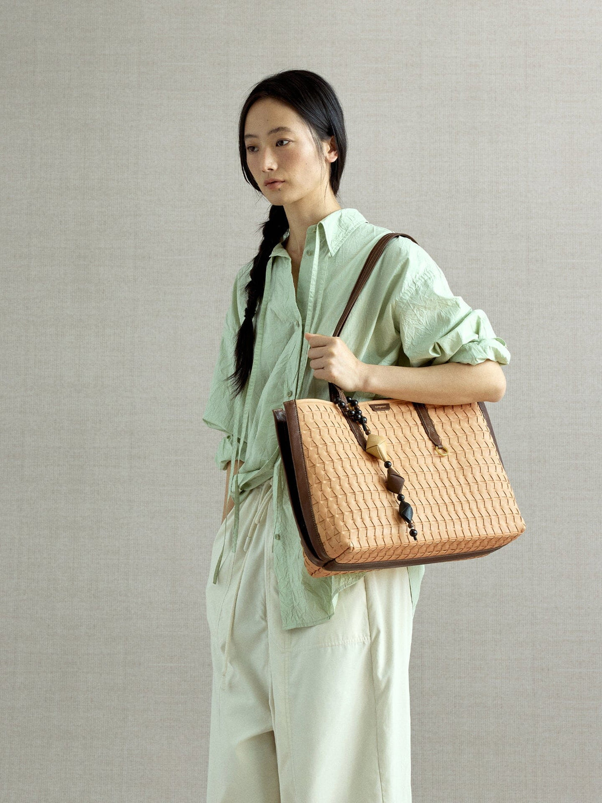 Songmont Medium Lattice Tote Sulfur - worn on the shoulder