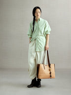 Songmont Medium Lattice Tote Sulfur - carried by hand