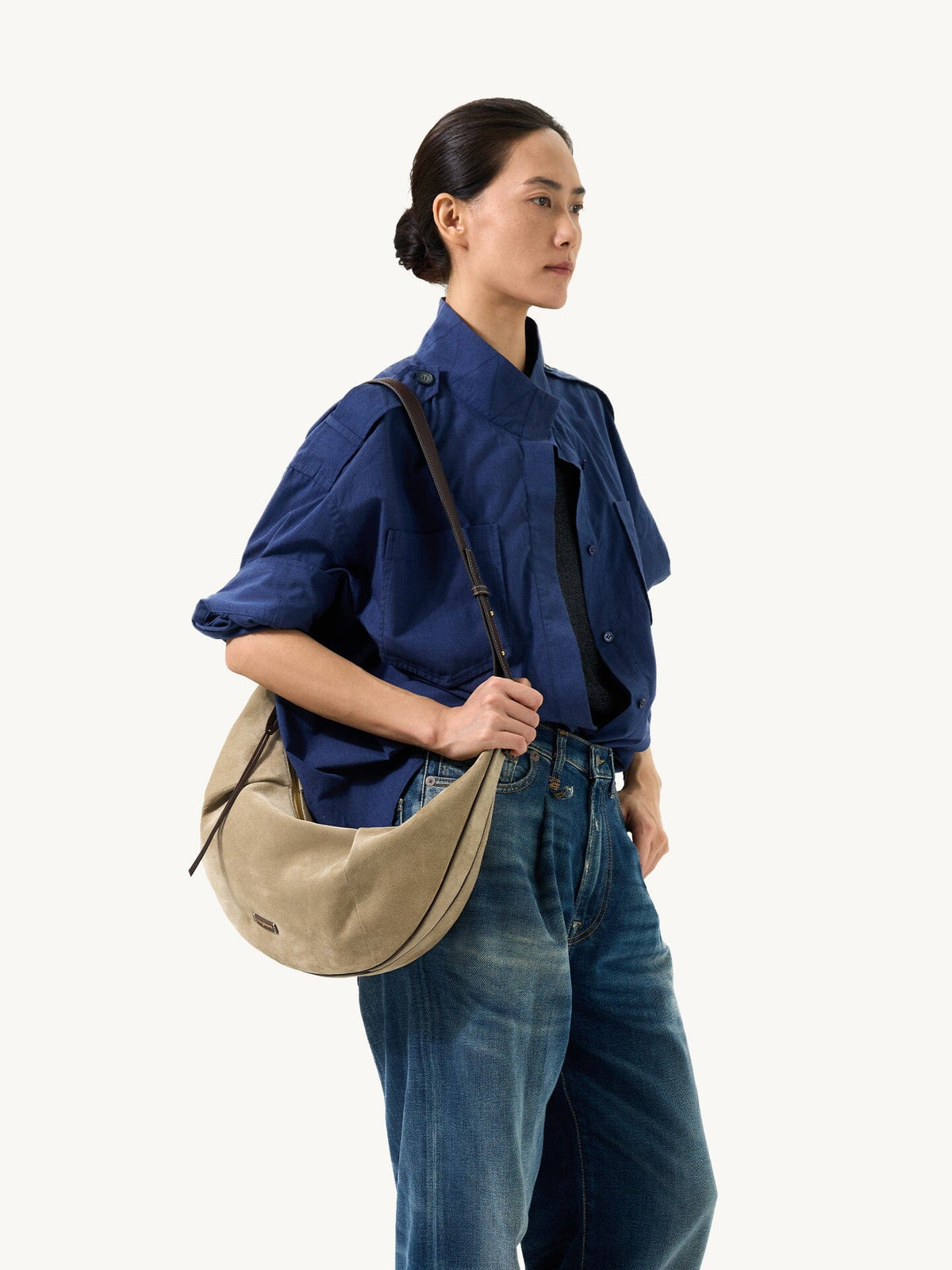 Songmont Large Luna Hobo Bag Dune Suede - worn on the shoulder with a navy shirt