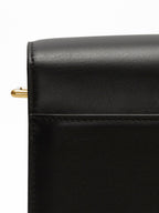 Songmont Medium Reset Tofu Bag Onyx - close-up of black calf leather and gold strap hook