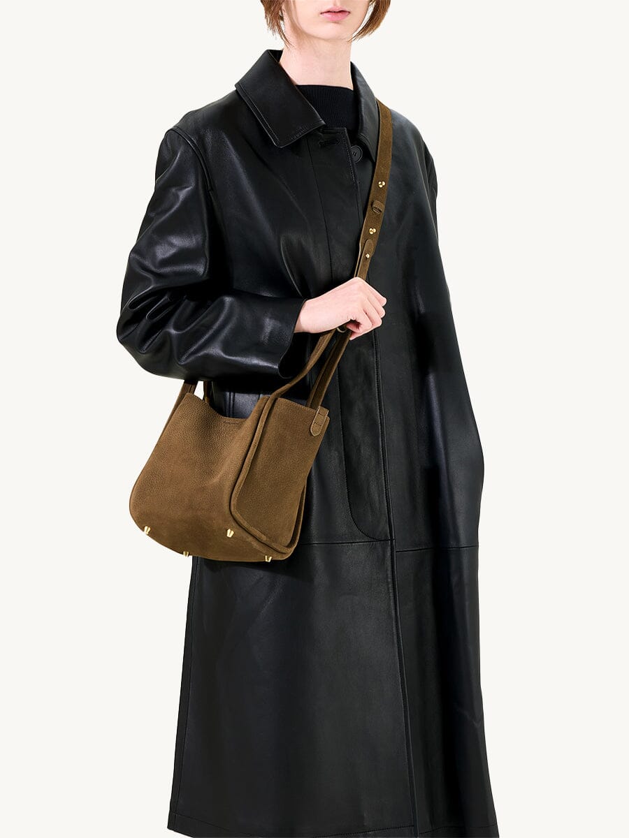 Songmont Medium Song Bag Agarwood worn crossbody over a coat
