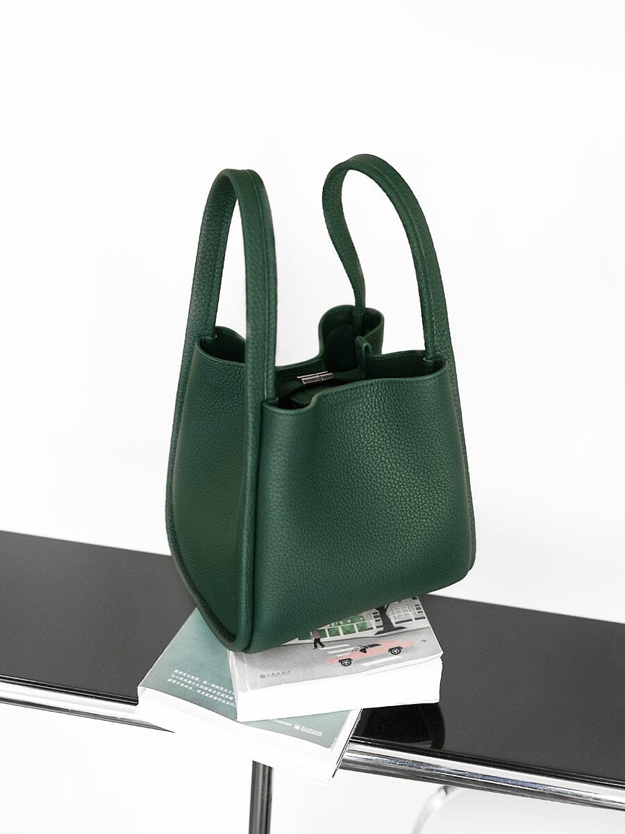 Songmont Medium Song Bag Emerald on a ledge
