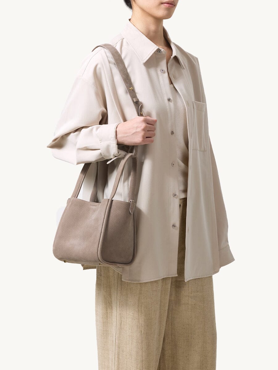 Songmont Medium Song Bag Haze worn on the shoulder