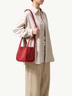 Songmont Medium Song Bag Poppy worn on the shoulder