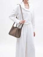 Songmont Medium Song Bag Taupe worn crossbody