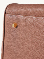 Songmont Medium Yore Duffle Bag Golden Brown - close-up of side stud and stitching