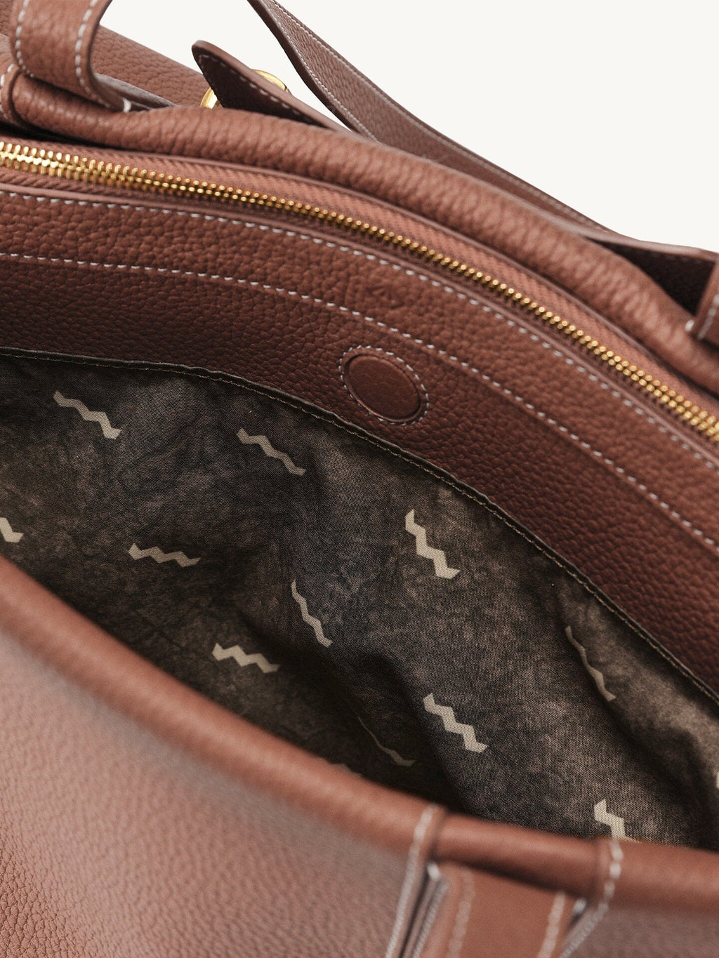 Songmont Medium Yore Duffle Bag Golden Brown - open interior with zip and patterned lining