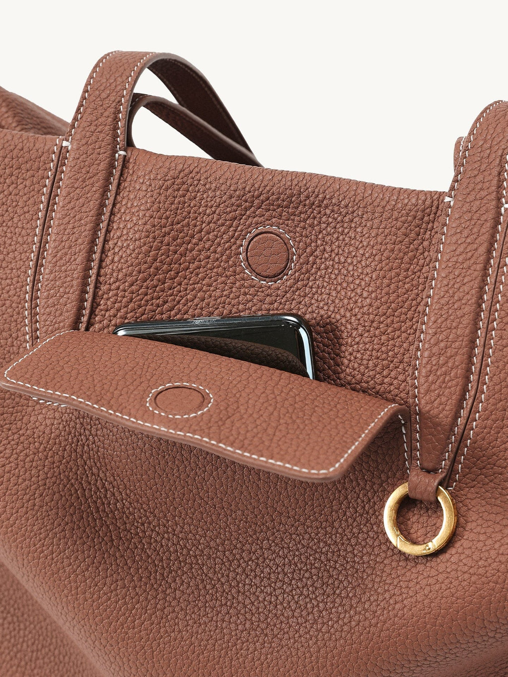 Songmont Medium Yore Duffle Bag Golden Brown - front pocket with a phone tucked in