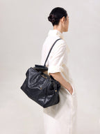 Songmont Medium Yore Duffle Bag Onyx - carried on the shoulder, side view