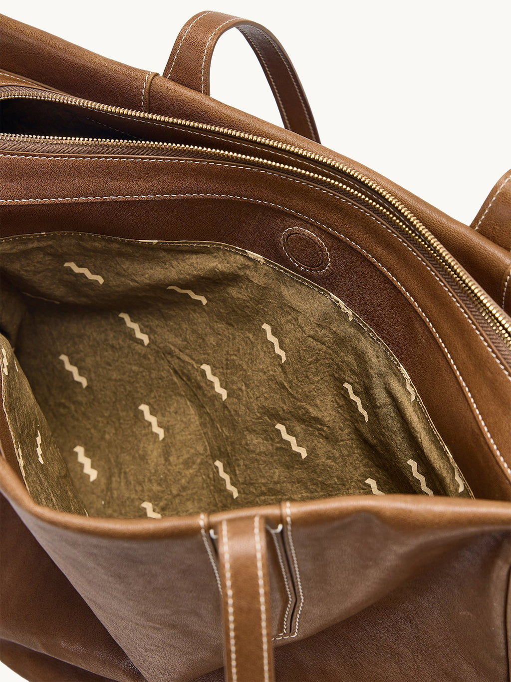 Songmont Medium Yore Duffle Bag Sandal - open interior with zip and patterned lining