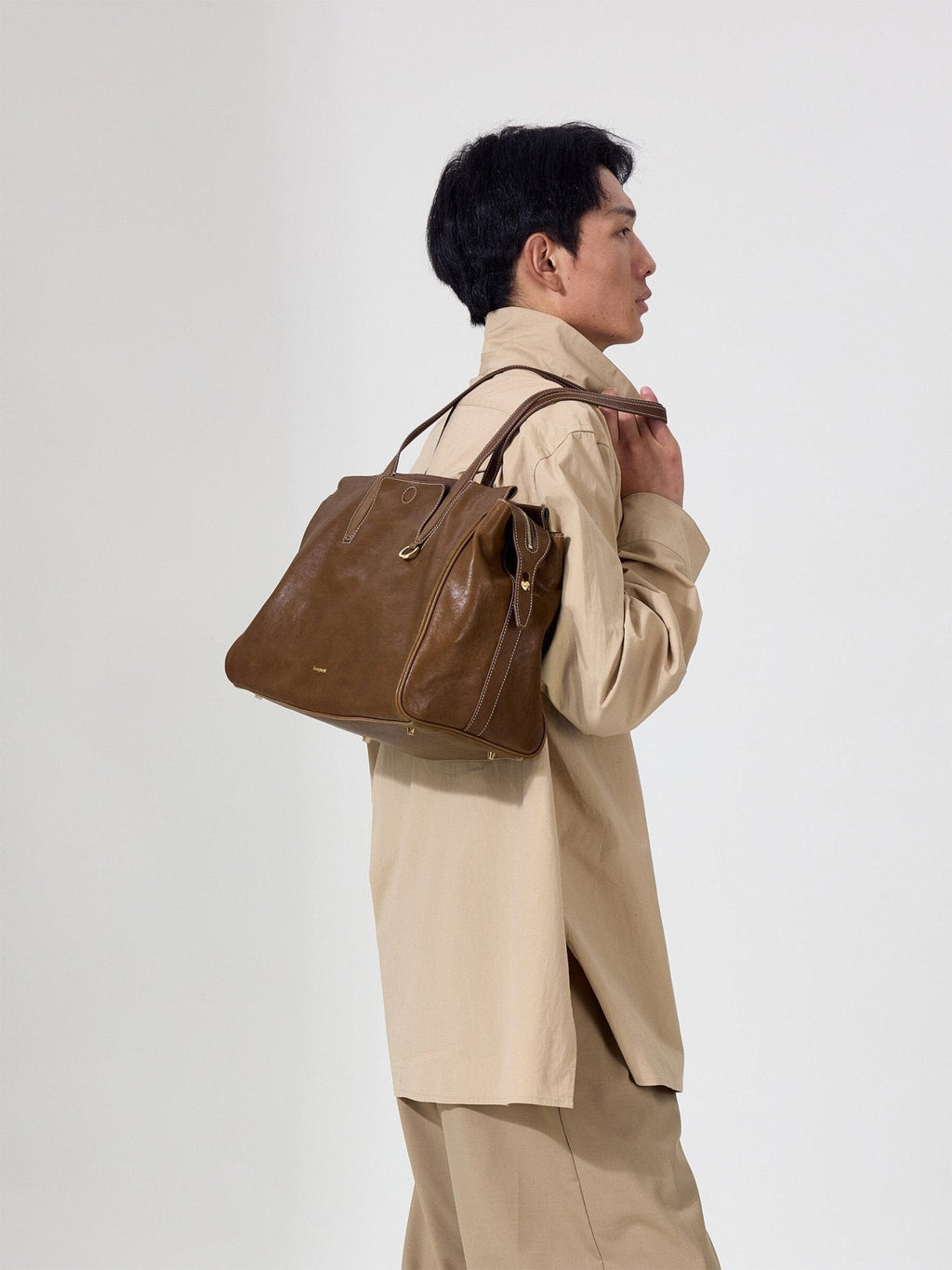 Songmont Medium Yore Duffle Bag Sandal - carried on the shoulder, side view