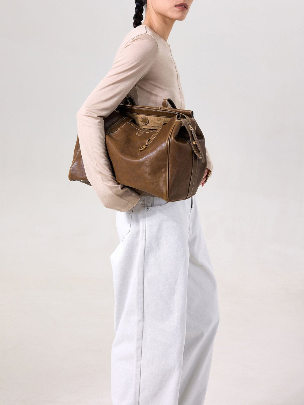 Songmont Medium Yore Duffle Bag Sandal - carried on the shoulder, close side view
