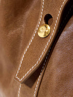 Songmont Medium Yore Duffle Bag Sandal - close-up of stitched handle and gold stud