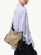 Songmont Medium Yore Hobo Bag Dune Suede worn on the shoulder