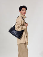 Songmont Medium Yore Hobo Bag Onyx worn on the shoulder
