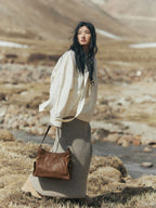 Songmont Medium Yore Hobo Bag Sandal worn on the shoulder