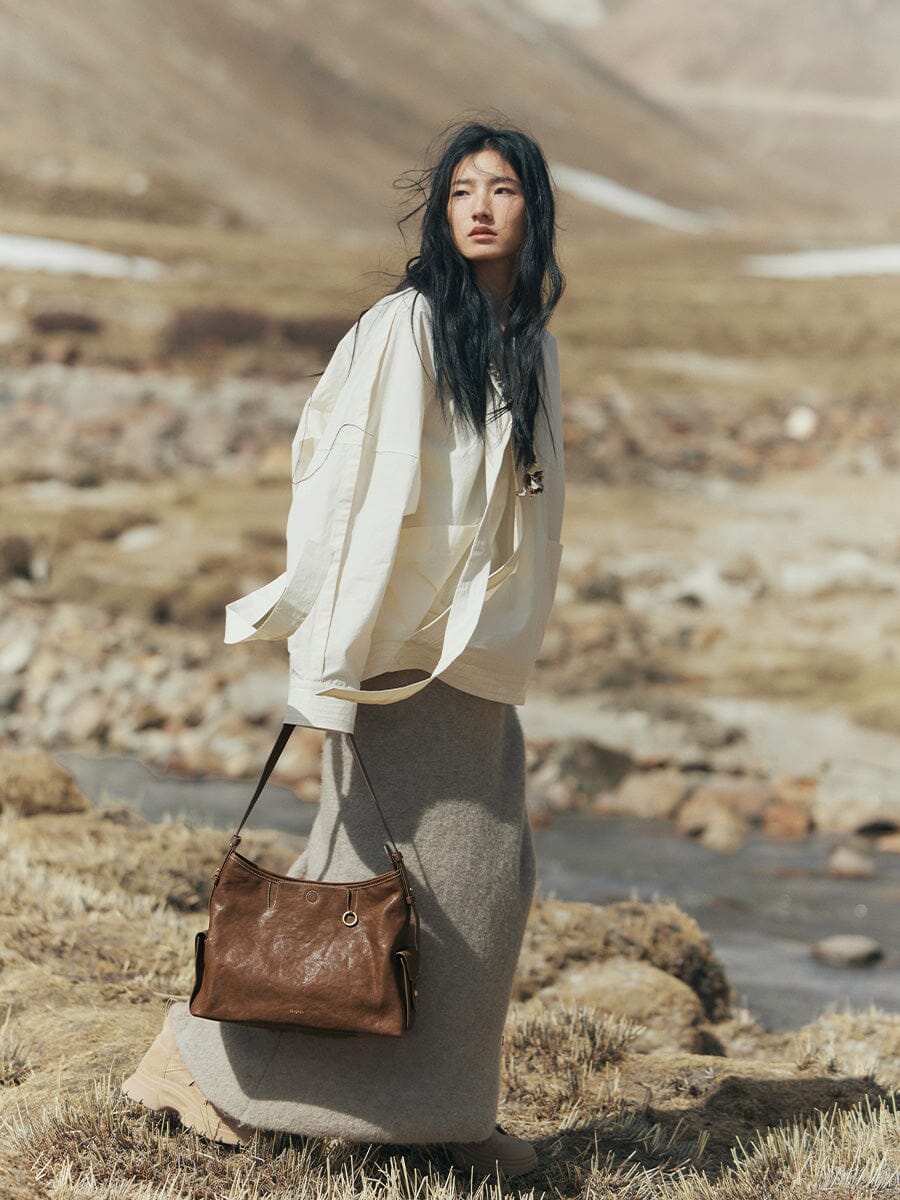 Songmont Medium Yore Hobo Bag Sandal worn on the shoulder