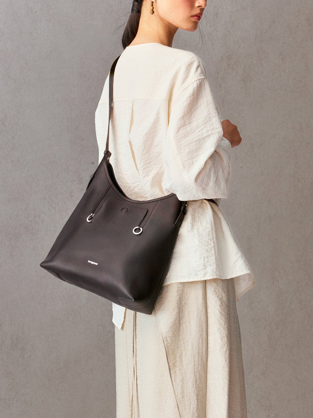 Songmont Medium Yore Shoulder Bag Ebony - worn over the shoulder, side view