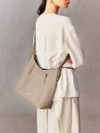 Songmont Medium Yore Shoulder Bag Smoke Grey - worn across the body, back view