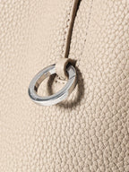 Songmont Medium Yore Shoulder Bag Smoke Grey - metal ring detail close-up