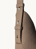 Songmont Medium Yore Shoulder Bag Stone - adjustable strap and buckle close-up