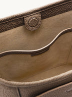 Songmont Medium Yore Shoulder Bag Stone - lining and magnetic snap close-up