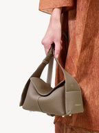 Songmont Mini Drippy Roof Bag Taupe - carried by the top handle