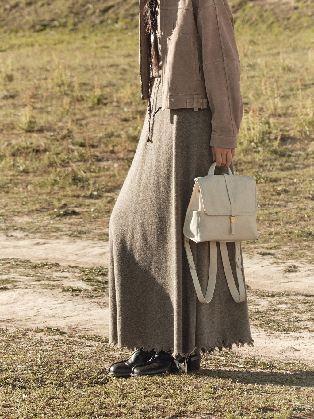Songmont Mini Shan Backpack Cloud - worn with the straps hanging at the back